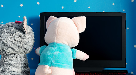 two toy playing on the laptop