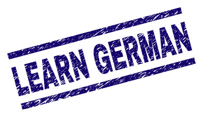 LEARN GERMAN seal print with scratced style. Blue vector rubber print of LEARN GERMAN text with scratched texture. Text label is placed between parallel lines.