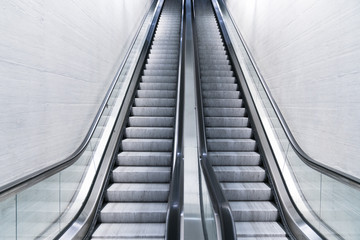 empty long escalator in a train station