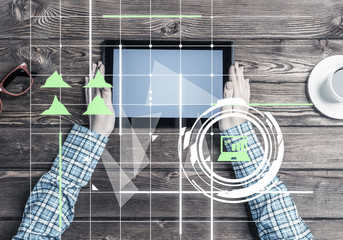 Obraz premium Business workplace with tablet device coffee cup and media graph