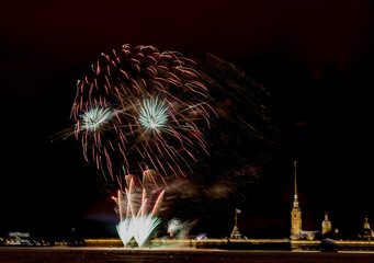 New year holiday fireworks on the banks of the Neva river in St. Petersburg.