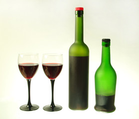 Two glasses of wine and two bottles Isolated on white