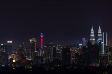Fototapeta na wymiar Night view of downtown Kuala Lumpur, a capital of Malaysia. Its modern skyline is dominated by the 451m-tall Petronas Twin Towers.