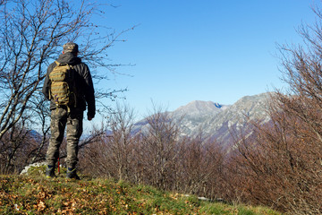 hiker on mountain peak mutria in italy matese