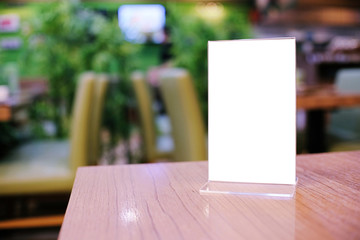 Menu frame standing on wood table in Bar restaurant cafe. space for text marketing promotion.