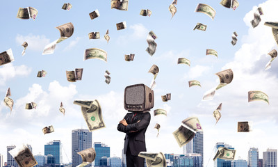 Businessman with old TV instead of head.