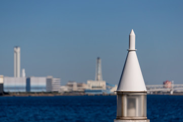 Fototapeta na wymiar 港にある灯台と青空と