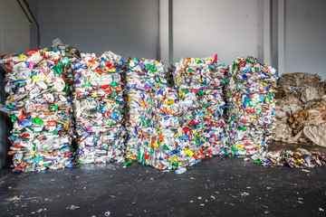 Plastic bales of rubbish at the waste treatment processing plant. Recycling separatee and storage...
