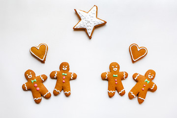 Fototapeta na wymiar Handmade festive gingerbread cookies in the form of stars and hearts for Valentine's Day