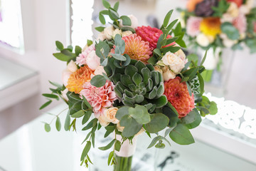 bright wedding bouquet of summer dahlias and roses