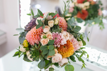 bright wedding bouquet of summer dahlias and roses