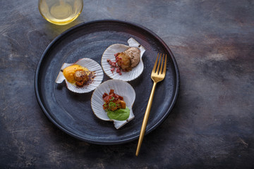 Top view of fried scallops on a plate, restaurant dish copy space