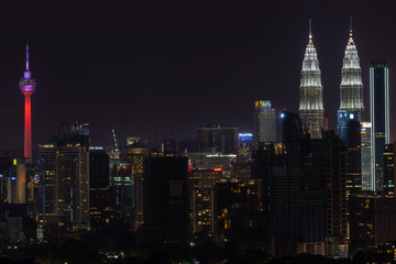 Fototapeta na wymiar KUALA LUMPUR, MALAYSIA - 31st DEC 2018; Night view of downtown Kuala Lumpur, a capital of Malaysia. Its modern skyline is dominated by the 451m-tall Petronas Twin Towers. 