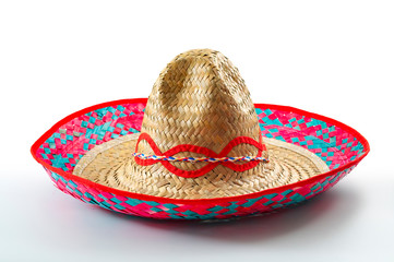 Cinco de mayo, traditional mexican hat and caribbean culture concept theme with close up on wicker...