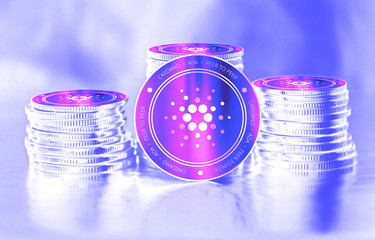 Cardano (ADA) digital crypto currency. Stack of coins. Cyber money.