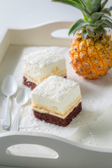 Closeup of homemade white cake with pineapple and brown bottom