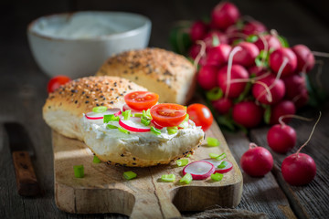 Sandwich with radish, creamy cheese and tomatoes
