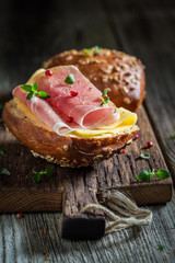 Closeup of delicious bun with ham and cheese for breakfast
