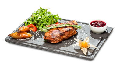 meat on bones on a stone rectangular plate