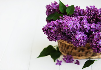 Basket with lilac flowers