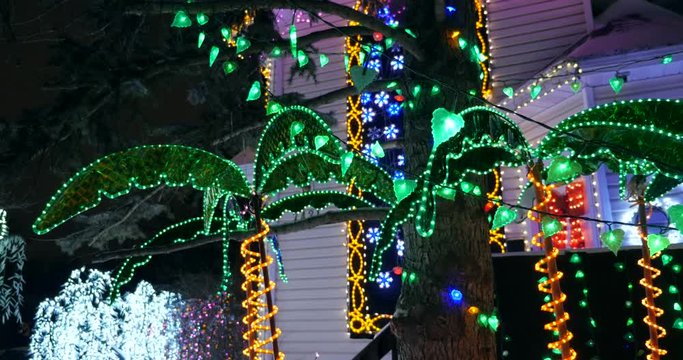 Tropical themed Christmas decorations and lights on a house decorated for Christmas