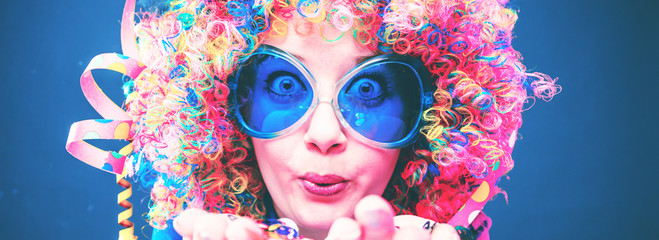 Portrait of beautiful party woman in wig and glasses Carneval. 
