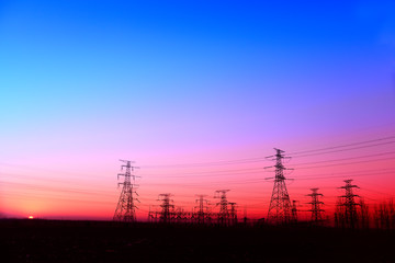 Fototapeta premium High piezoelectric towers, in the setting sun