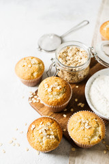 Homemade tasty oat miffins on white background