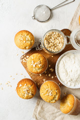Homemade tasty oat miffins on white background