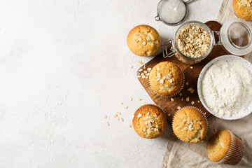 Homemade tasty oat miffins on white background