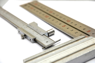 the measuring tool of a carpenter and a locksmith on a white background