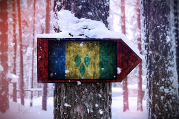The Saint Vincent and the Grenadines flag attached to the tree as a sign.