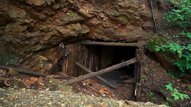 The entrance to the uranium mine. Collapsing vaults. Groundwater flooded floor.