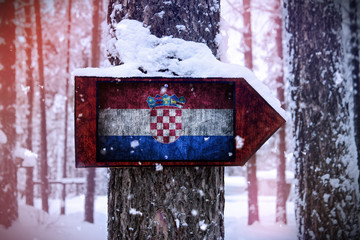 The Croatian flag attached to the tree as a sign.