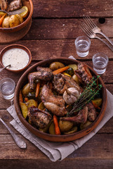 Oven baked rabbit with garlic sauce, copy space
