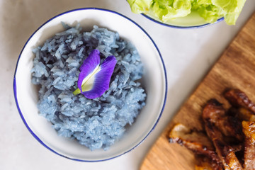Butterfly pea purple sticky rice, decorated with Butterfly pea flower. Fusion Thai food.