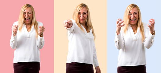 Set of Middle age blonde woman with white shirt annoyed angry in furious gesture.