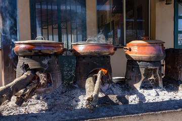 Drakona Greece, 12-14-2018 Traditional  Cretan cooking over a wood fire in Crete Greece.