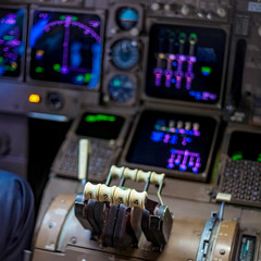 Close up of flight controls in an airplane cockpit - obrazy, fototapety, plakaty