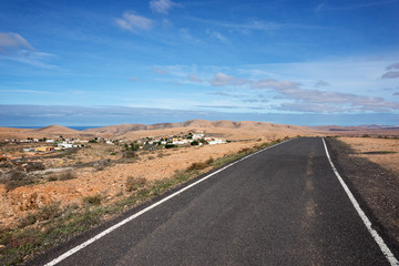 Fototapeta na wymiar Lonely Road in the mountains. Fuerteventura. Canary Islands. Spain