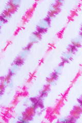 striped tie dye pattern hand dyed on cotton fabric abstract background.