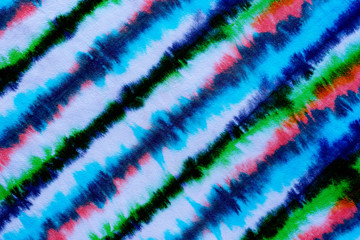 striped tie dye pattern hand dyed on cotton fabric abstract background.