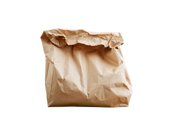 Closeup wrapped and crumpled brown paper bag isolated on white