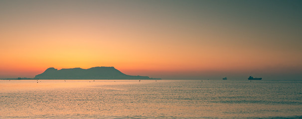 Amazing panoramic view on the rock of Gibraltar during sunset and the ships around it.