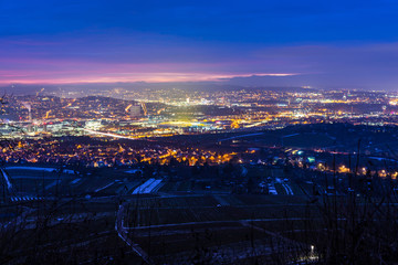 Germany, Stuttgart city metropolis industry and arena after sunset in stunning light