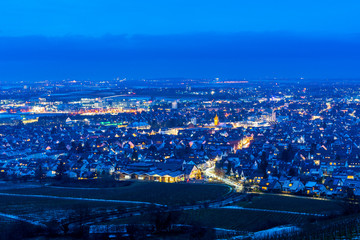 Germany, Above houses and streets of city of fellbach in blue hour atmosphere