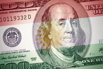Obraz na płótnie Canvas flag of kurdistan on a american dollar money background