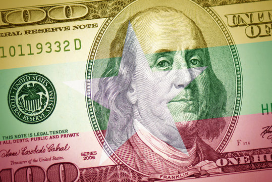 Flag Of Myanmar On A American Dollar Money Background