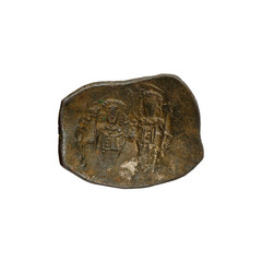 Concave ancient copper or bronze byzantine coin isolated on white