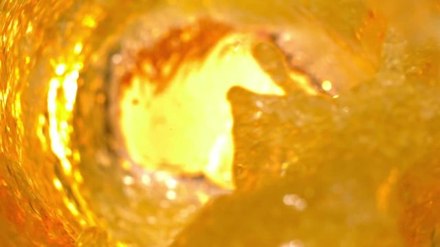 Cold Beer Splashing Out inside a Glass with High Speed Shot on Phantom Camera